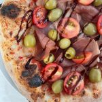 Prosciutto, Olive, and Cherry Tomato Pizza - Post Bake Toppings